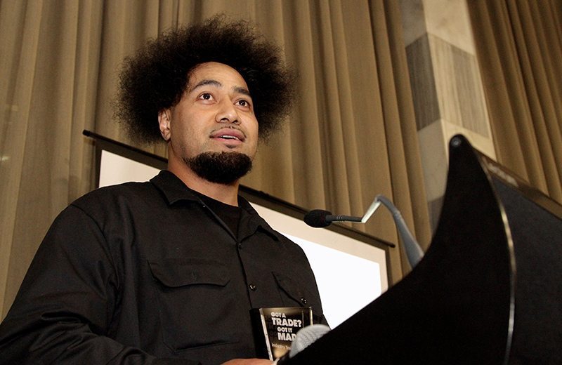 Peleti Oli accepts the Pasifika Community Impact Award